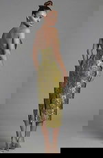 Fitted metallic brocade evening dress with structured bodice and shawl