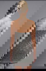 Back view of strapless embellished mini dress with smooth fitted finish