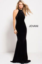 model wearing Jovani 51680 black velvet mermaid gown side view