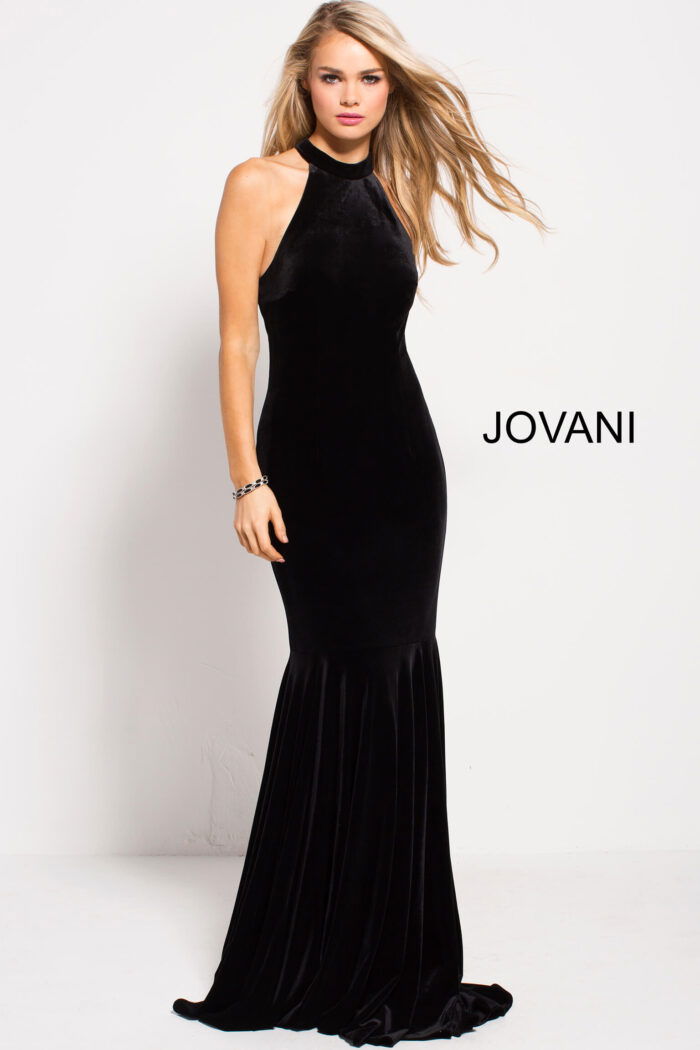 model wearing Jovani 51680 black velvet mermaid gown side view