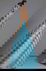 Strapless high low brocade dress with structured bodice and flowing back skirt