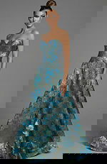 strapless brocade ball gown with fitted waist and flowing skirt