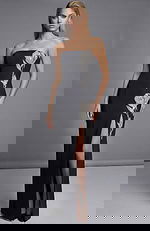 Strapless black evening gown with crystal floral embellishment and thigh high slit