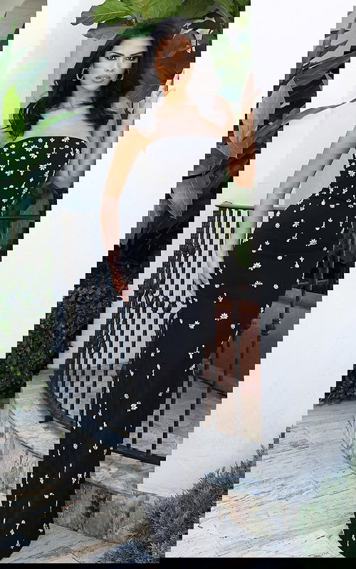 Jovani 51807 black strapless fitted column gown with scattered silver crystal floral and bow embellishments throughout and sheer illusion neckline