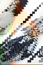 Strapless black and white printed mini dress with structured bodice and voluminous bubble skirt