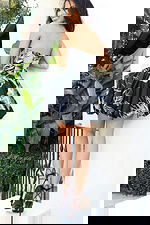 Strapless bubble hem mini dress with structured bodice and abstract print