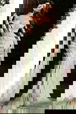 Front view of sage off shoulder beaded evening gown with draped sheer sleeves