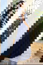 Jovani 53168 navy sleeveless high neck jumpsuit back view showing floral applique at the neckline, open back cutout, and flowing wide leg pants with sweep train