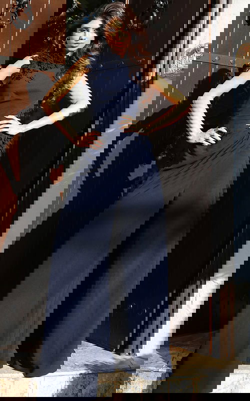 Jovani 53168 navy sleeveless high neck jumpsuit with 3D floral applique detailing at the neckline and waist, and wide leg pants