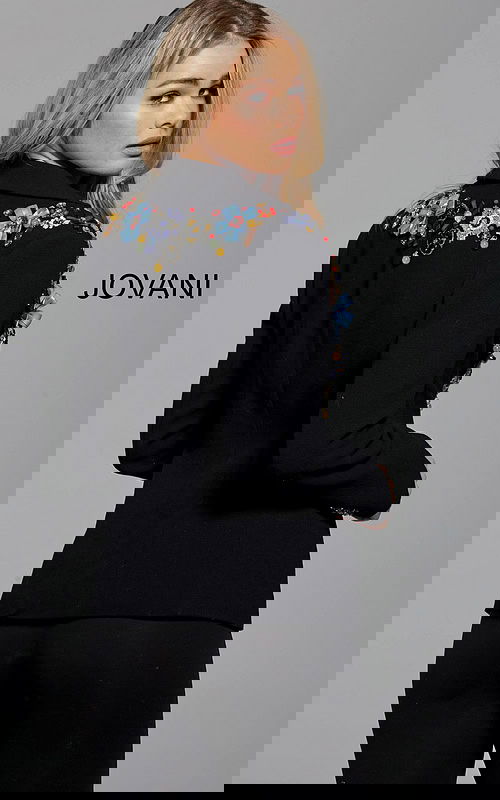 Model wearing Jovani M55213 black blazer with floral embellishments, back view