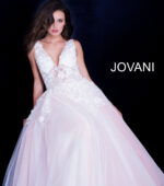 model wearing Jovani 55634 white gown with lace detailing