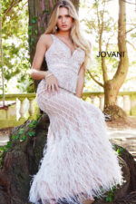Model wearing Jovani 55796 ivory dress with detailed beadwork and V-neckline.