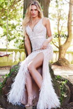 Front view of Jovani 55796 ivory gown with detailed beadwork and feathers.