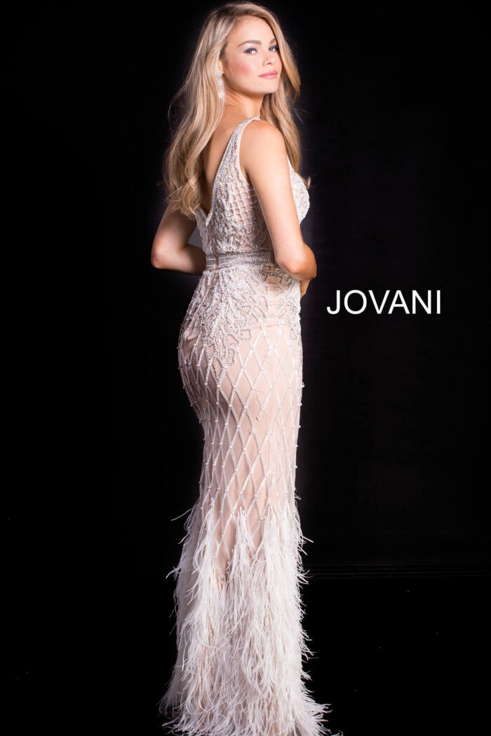 Back view of model wearing Jovani 55796 ivory gown with intricate beading.