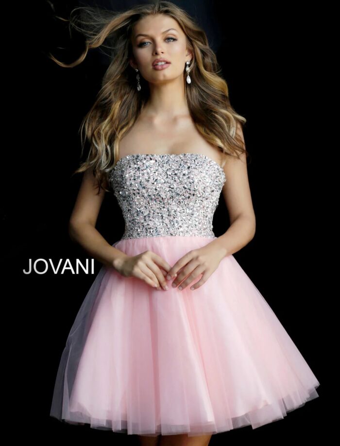 Model wearing Jovani 58470 blush dress with sequin bodice and tulle skirt, front view.