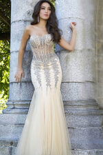 Model wearing Jovani 5908 beige mermaid gown with beaded details