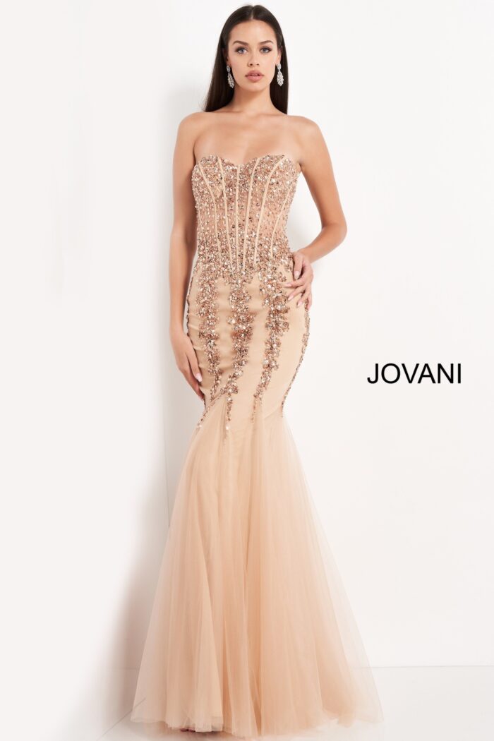 Model wearing Jovani 5908 nude mermaid gown with intricate embellishments