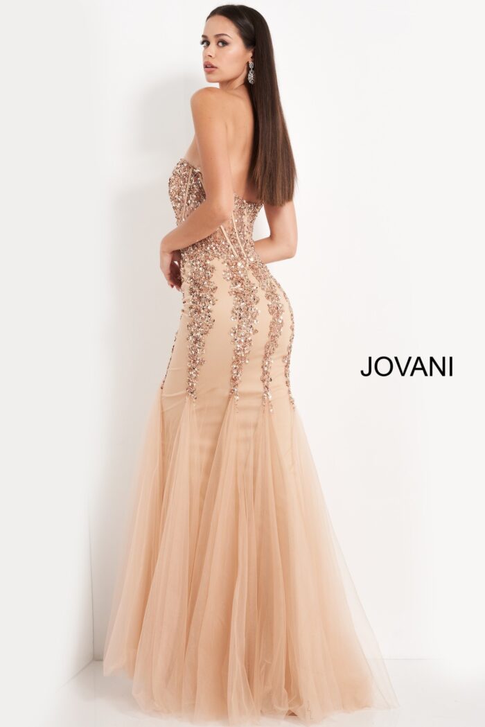 Back view of model wearing Jovani 5908 beige mermaid gown.