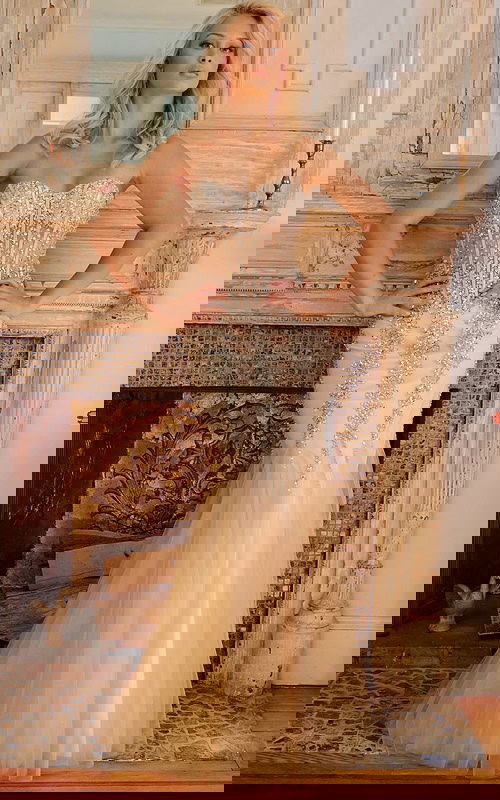 Model wearing Jovani 5908 beige gown with intricate beaded embellishments.