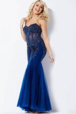 Model wearing Jovani 5908 navy gown with sweetheart neckline and ornate details.