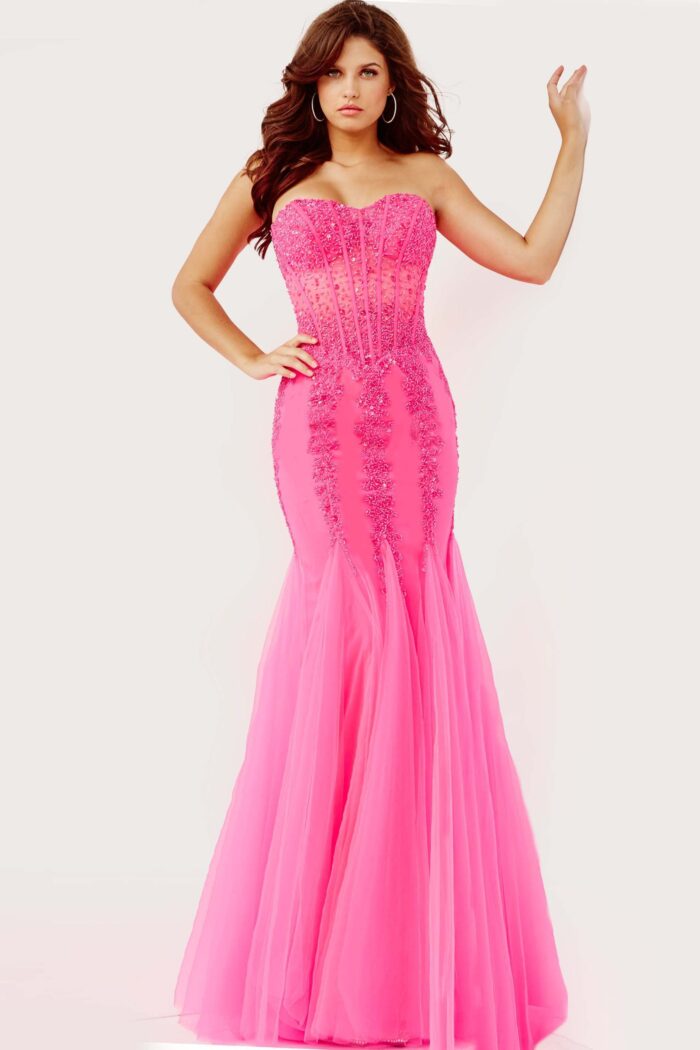 Model wearing Jovani 5908 pink mermaid gown with sweetheart neckline and embellishments.