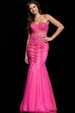 Model wearing Jovani 5908 pink gown with sweetheart neckline and intricate embellishments.