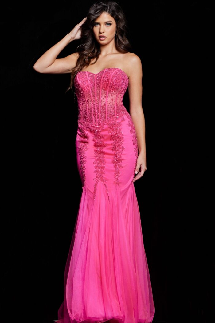 Model in Jovani 5908 pink gown with tulle mermaid skirt and embellishments.