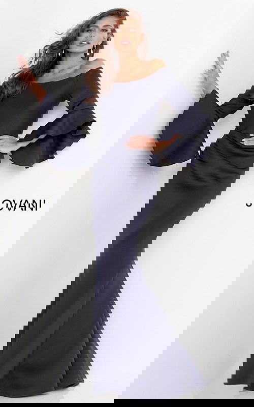 Model wearing Jovani 59993 Navy gown with off-the-shoulder neckline and voluminous sleeves.