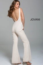 model wearing Jovani 60017 in ivory showing open back design