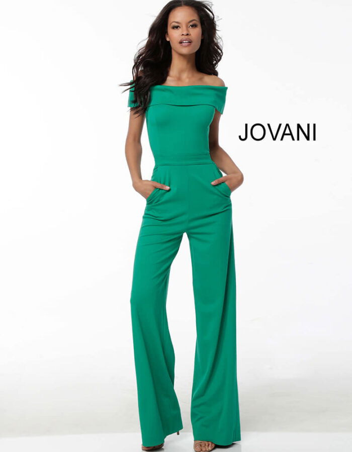 Model wearing Jovani 60103 green jumpsuit with off-the-shoulder neckline and wide-leg pants.