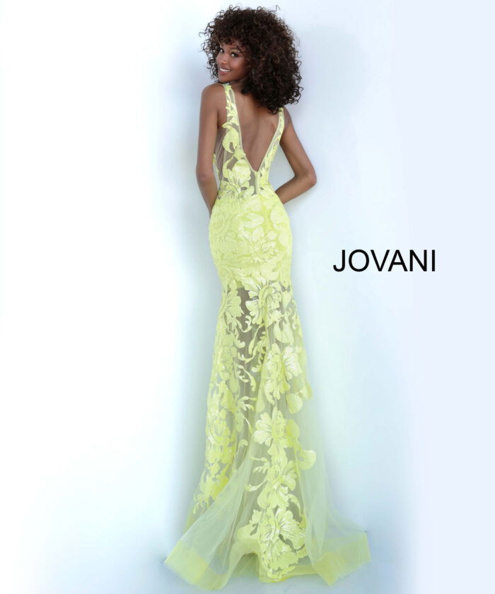 Model wearing Jovani 60283 in yellow, back view of elegant lace gown.