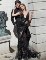 Models in Jovani 60283 in black and red, showing lace detail.