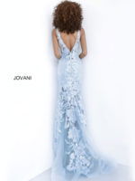 Model wearing Jovani 60283 in blue, back view of lace gown.