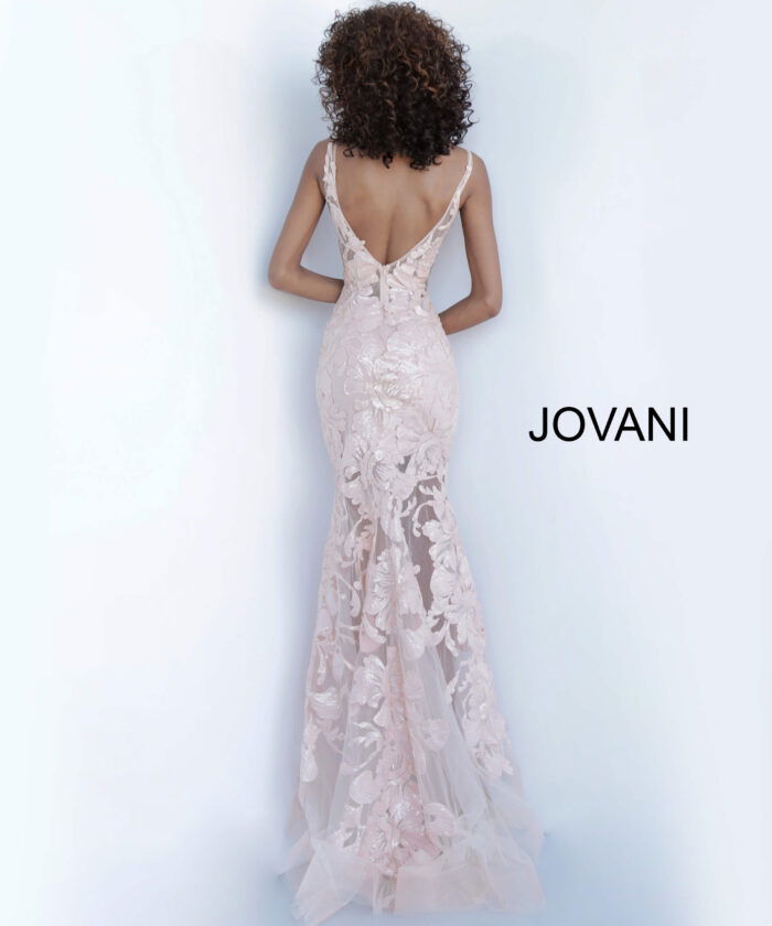 Model wearing Jovani 60283 in pink, back view of lace dress.