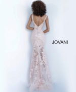 Model wearing Jovani 60283 in pink, back view of lace dress.