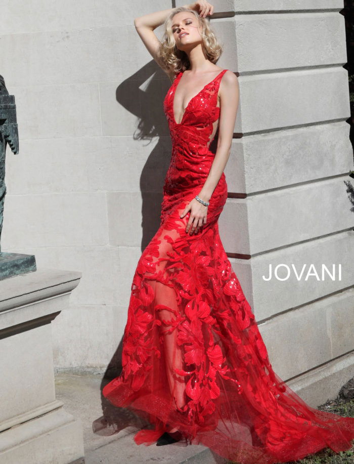 Model wearing Jovani 60283 in red, full front view of lace dress.