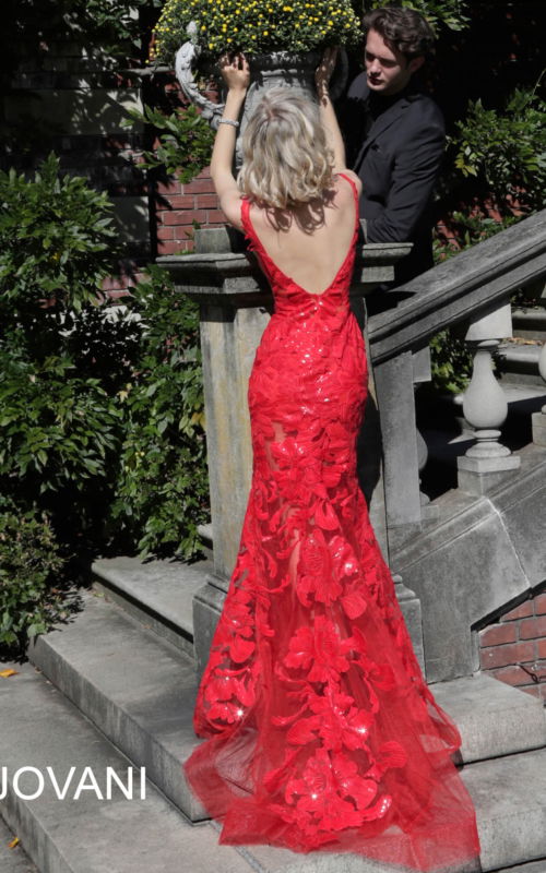 Back view of Jovani 60283 red mermaid gown showcasing intricate lace detailing.