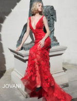 Model wearing Jovani 60283 in red, front full view.