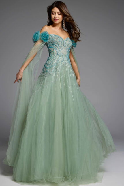 Off-the-shoulder green gown with delicate tulle cape detailing