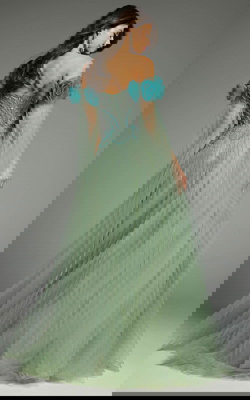 Back view of a green tulle dress showcasing layered elegance