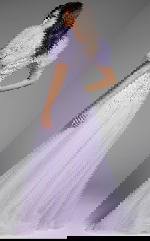 Back view of a lilac gown showcasing puffed sleeves and detailed beadwork.