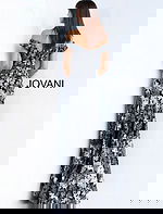 Model wearing Jovani 61380 black dress with off-shoulder neckline and floral embroidery, full front view.