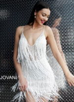 Model wearing Jovani 61883 Teal Fringe Spaghetti Strap Cocktail Dress