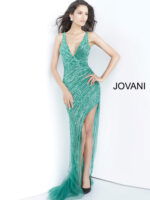 Model in Jovani 63405 emerald gown with high slit and deep V-neckline