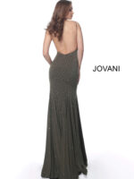 Model showcasing the back of Jovani 63563 green gown with open back design