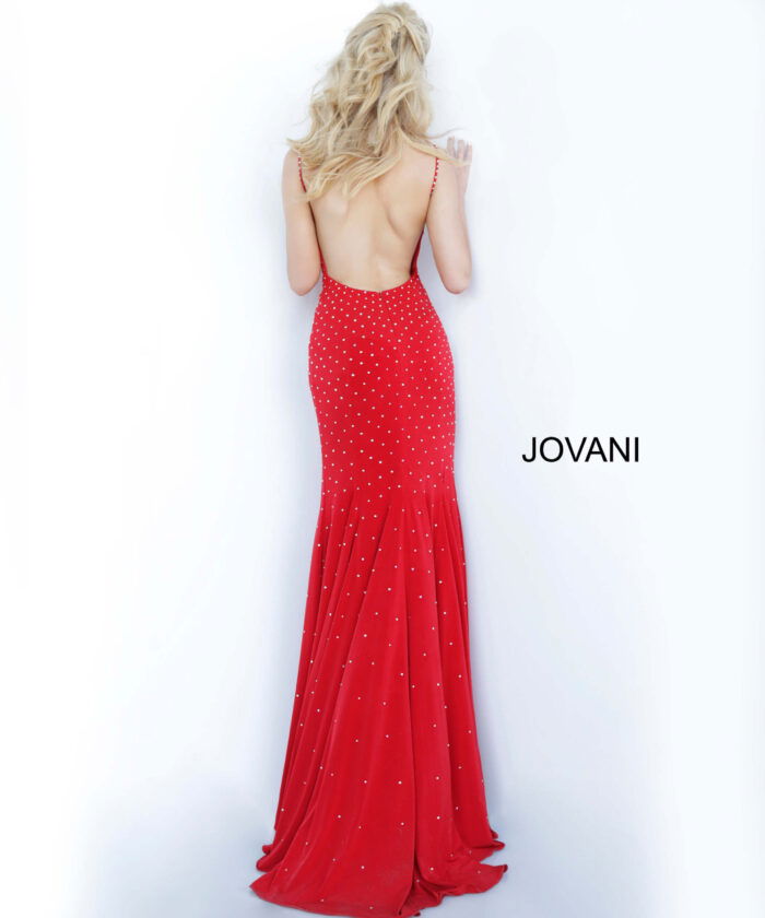 Model showcasing the back of Jovani 63563 red gown with elegant design