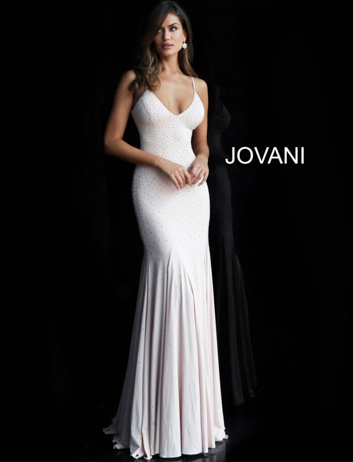 Model wearing Jovani 63563 blush gown with elegant design and embellishments