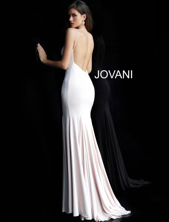 Model showcasing the back of Jovani 63563 blush gown with low back