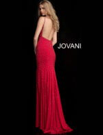 Model showcasing the back of Jovani 63563 red dress with open back