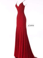 Model showcasing the back of Jovani 63563 red gown with open back
